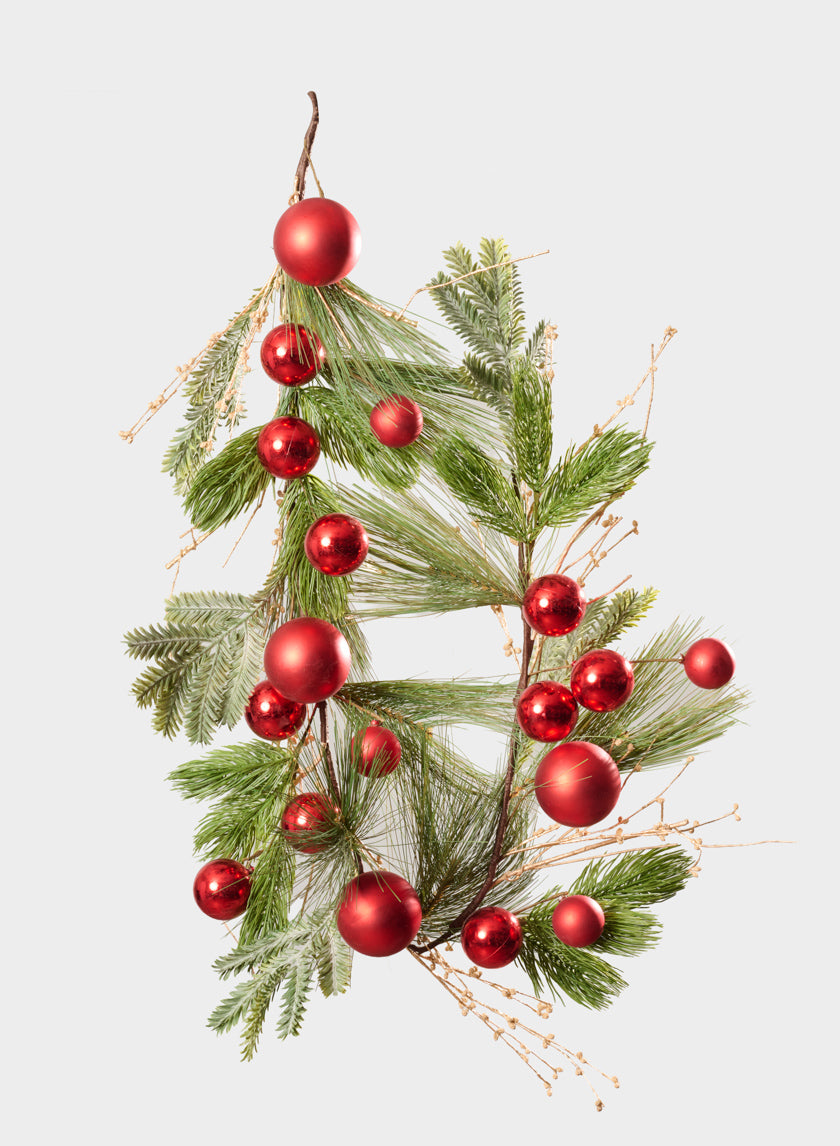 A 60in long Classic Pine Garland adorned with shiny red ornaments and glitter berries, beautifully arranged against a plain white background.