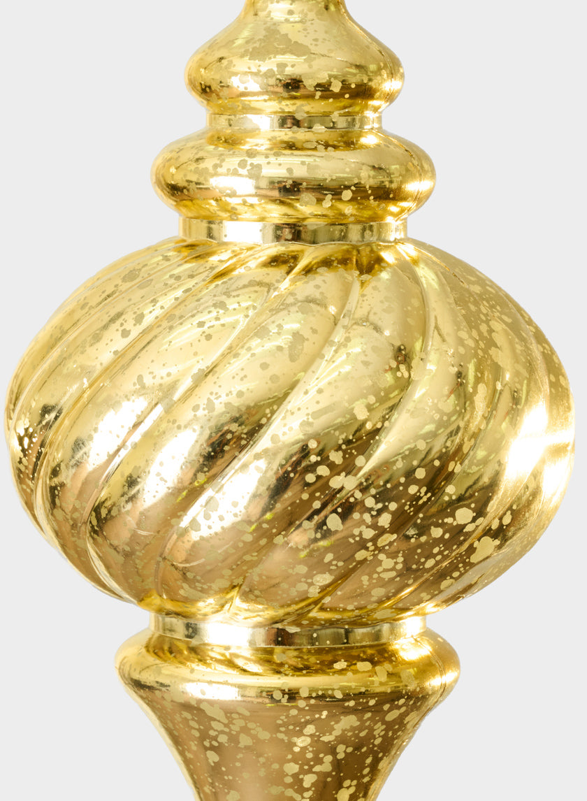 Close-up of a 10in Plastic "Real Mercury Glass Look" Gold Finial Ornament featuring a shiny, gold, spiral-patterned design with a textured, speckled surface that reflects light.