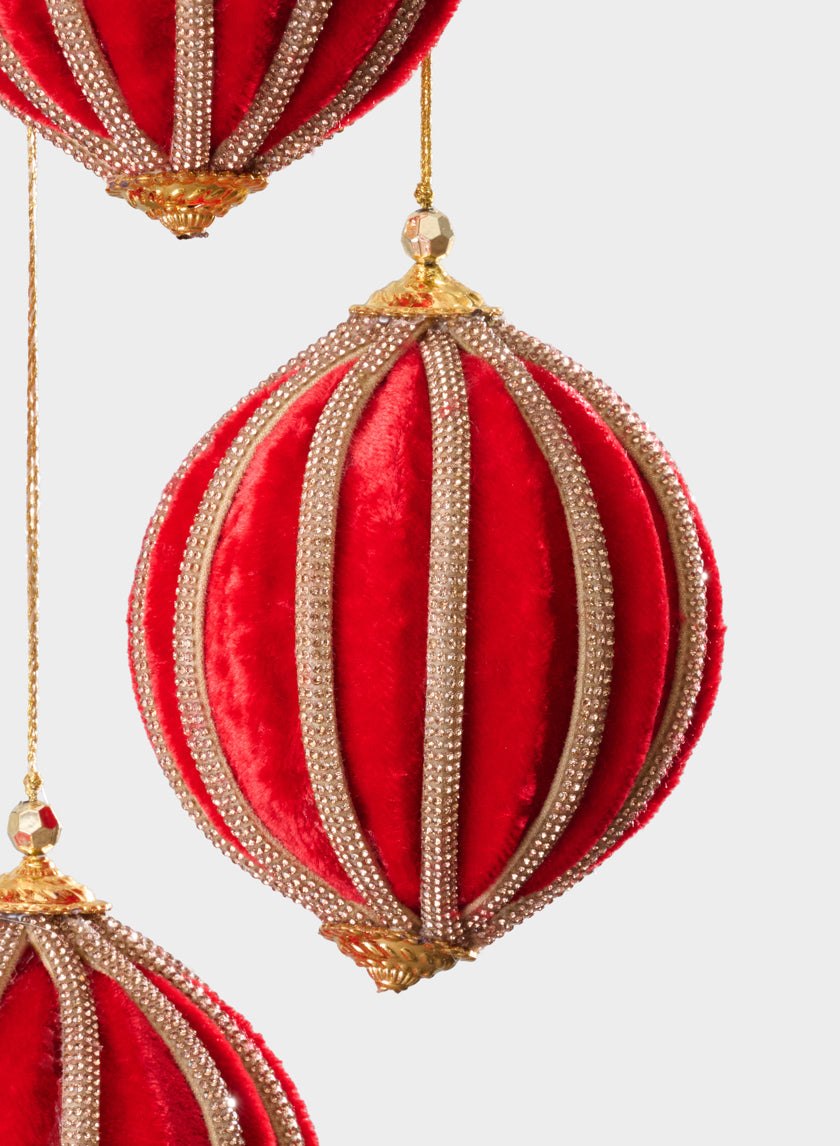 Three 4in Round Red Velvet & Rhinestone Decorative Hanging Ball Ornaments hang against a plain white background. Two ornaments are partially visible at the edges, and one is centered.