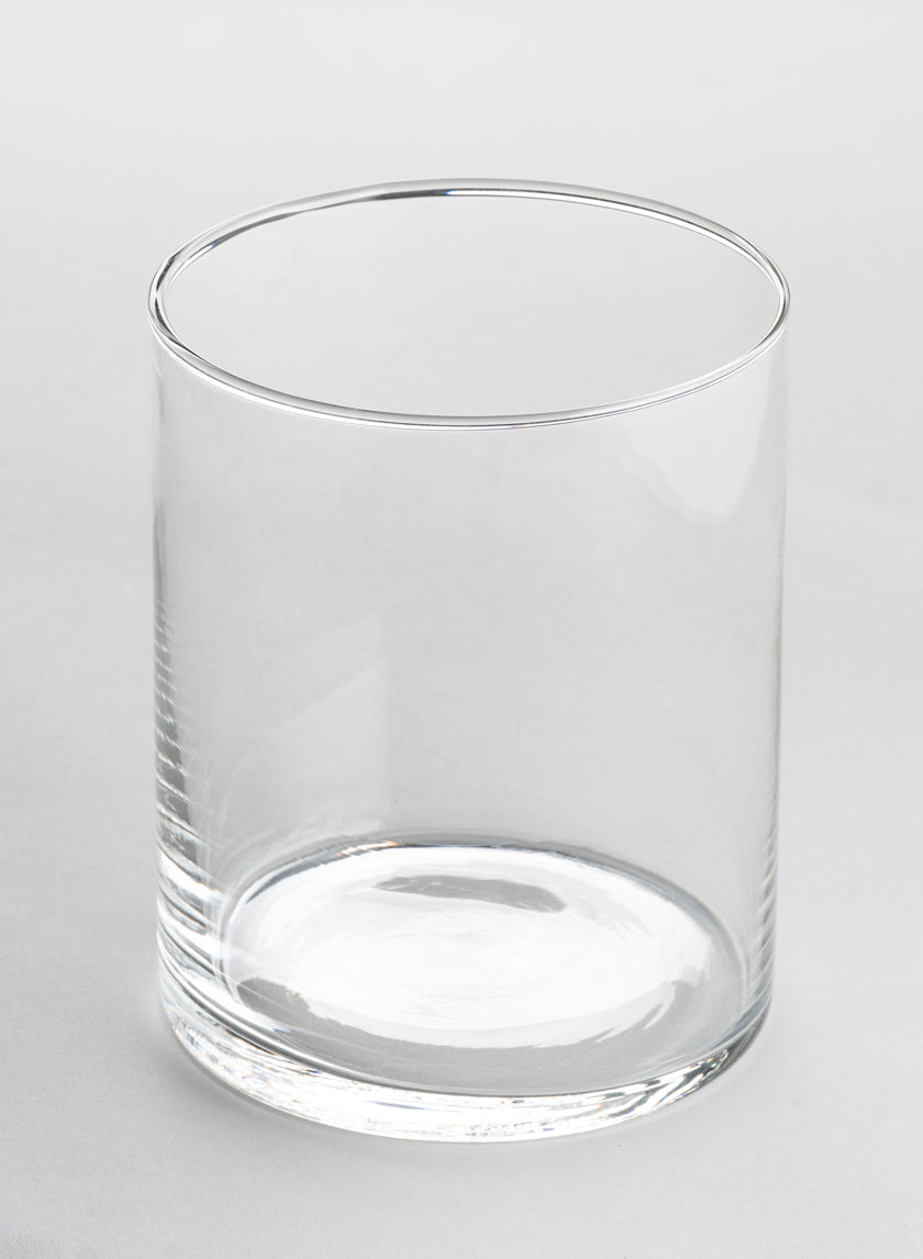 A set of 6 Best Value Glass Cylinder Vases sits empty on a plain, light gray surface, photographed against a neutral background.