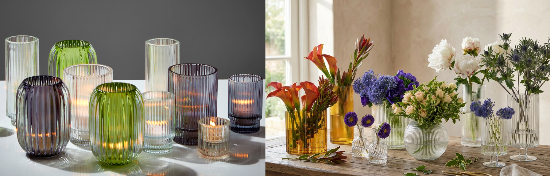 Collection of colorful glass vases and candle holders on a table.