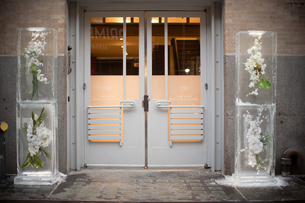 A dressed up entrance: Custom ice sculptures with frozen flowers.