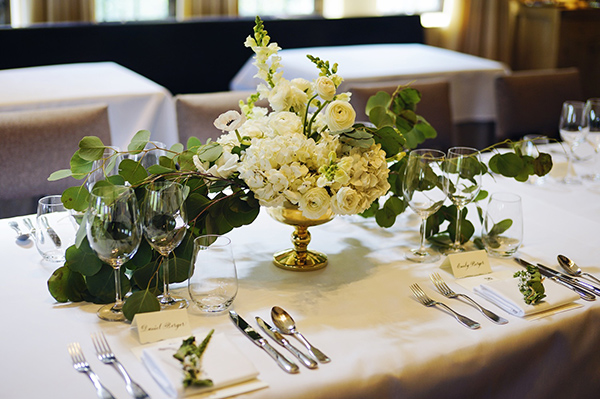 The white and green floral centerpiece.