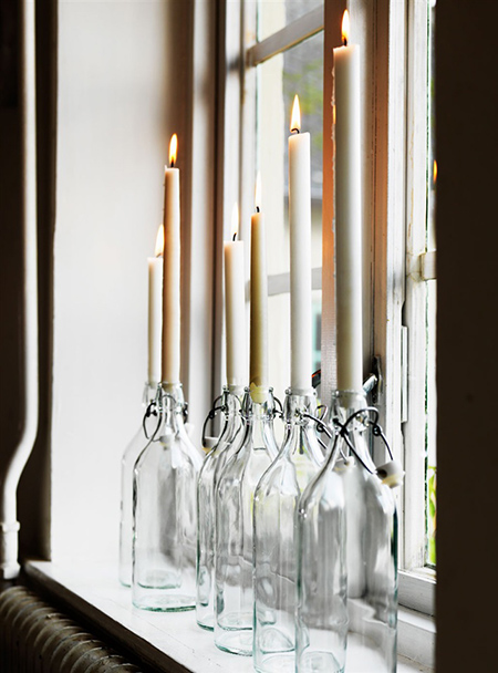 classic french cafe bottles as candleholders
