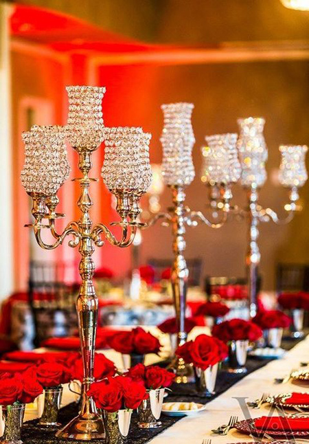 crystal candelabra and red rose in julep cup centerpiece