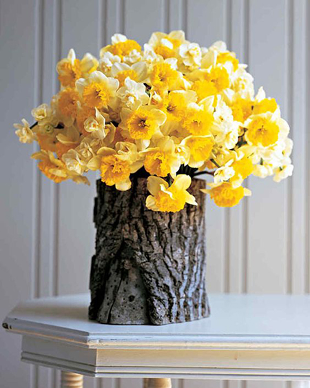 yellow daffodil arrangement in faux bois vase