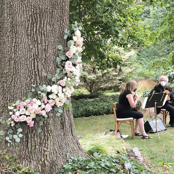 eucalyptus garland with pink roses outdoor wedding