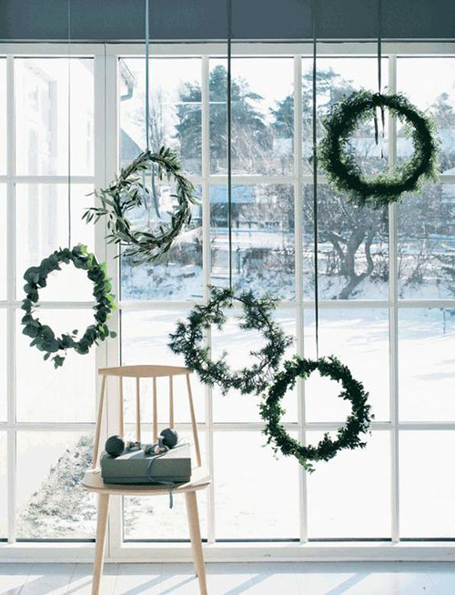 mini wreaths in window for winter wedding decor