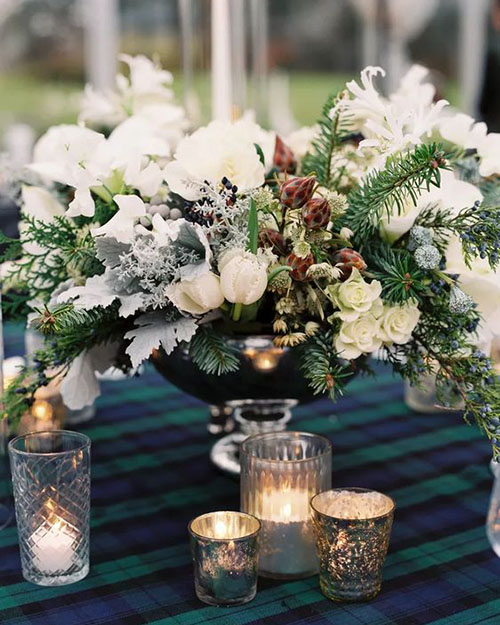 winter wedding centerpiece with plaid tablecloth