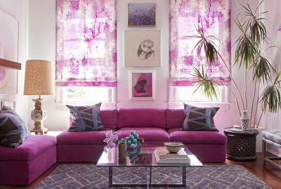 living room with magenta curtains and couch