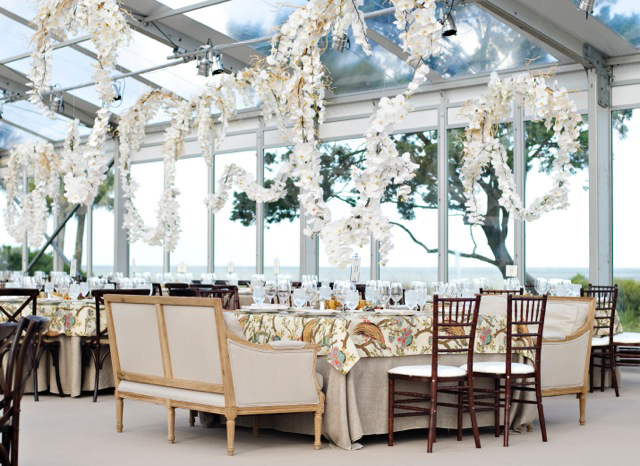 clear wedding tent reception with white phalaenopsis orchid garlands
