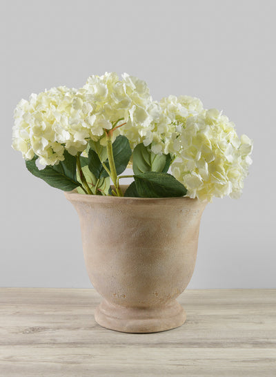 Petra aged clay urns in beige tones styled as entryway or living room statement planters