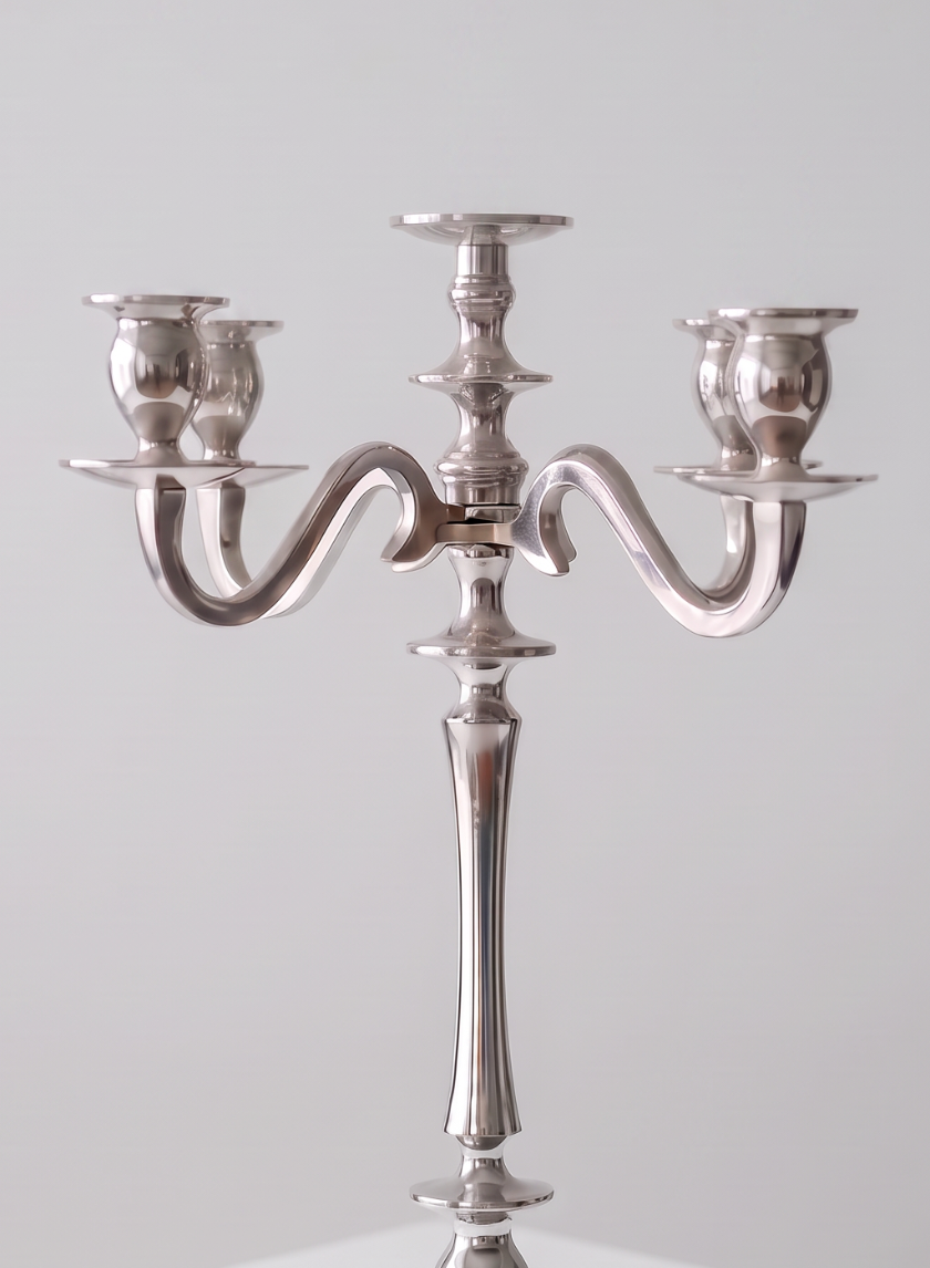 A 25.75in tall silver metal candelabra featuring three candle holders on elegantly curved arms, set against a plain light gray background.