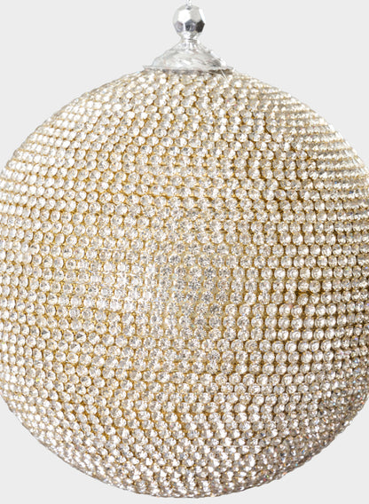 A close-up of the 5in Round Champagne Full Rhinestone Beaded Ornament Ball, featuring rows of small, shiny gold and silver rhinestones and topped with a metallic cap, set against a plain light background.