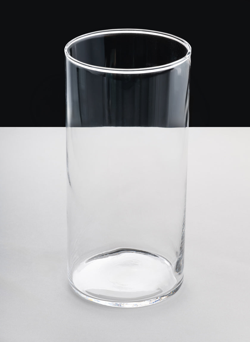 A set of 6 Best Value Glass Cylinder Vases is displayed, each empty and clear, sitting on a flat, light gray surface with a black background.