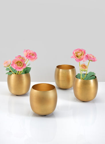 Set of gold egg-shaped vases with pink flowers on a white background