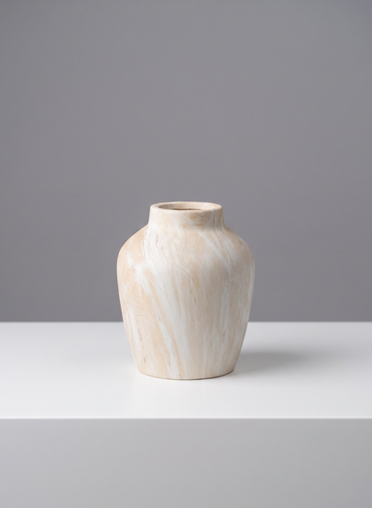 A 4in tall "Travertine Look" ceramic mini vase, featuring a beige and white marbled design with a wide body and narrow neck, sits on a white surface against a plain gray background.