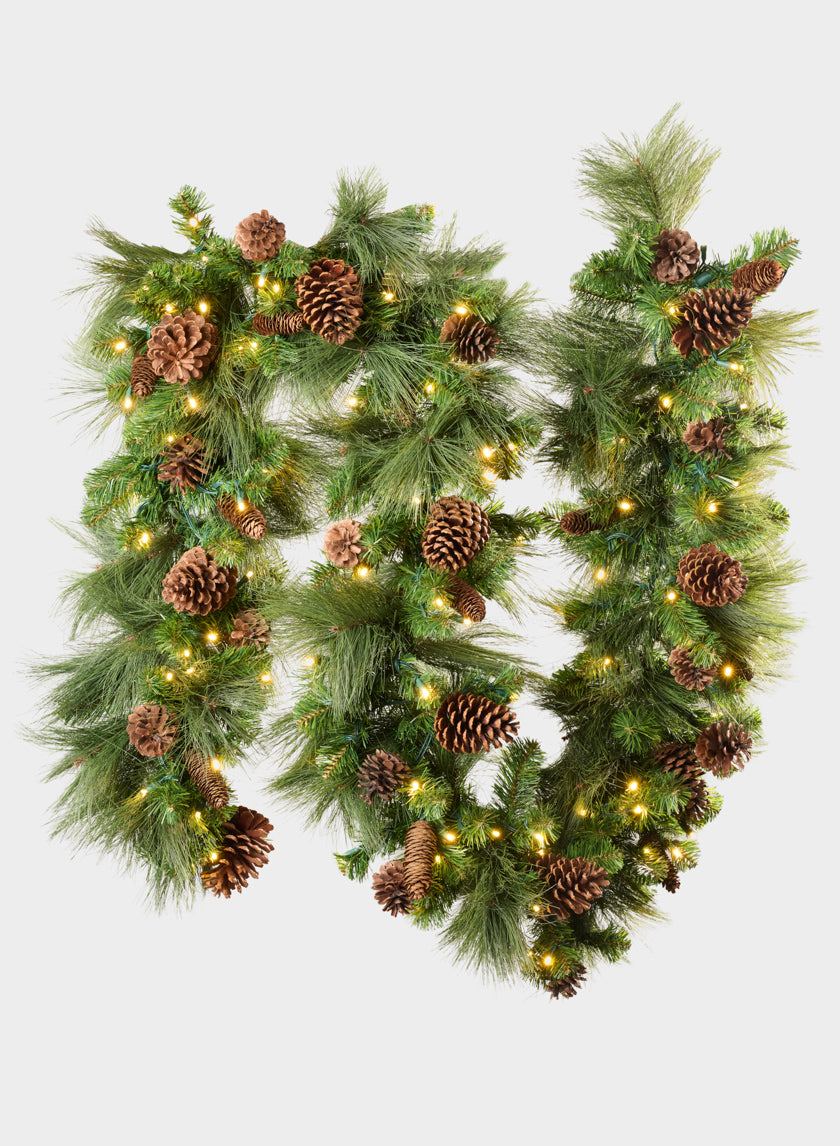 115-inch hard needle garland featuring 35 pinecones and 195 tips, adorned with warm white lights and arranged in two loops against a plain white background.