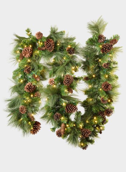115-inch hard needle garland featuring 35 pinecones and 195 tips, adorned with warm white lights and arranged in two loops against a plain white background.